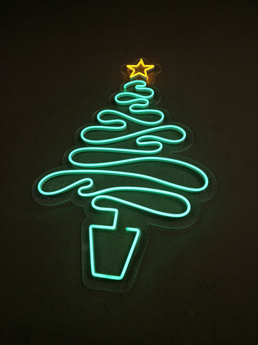 Neon sign shaped like a Christmas tree in glowing turquoise light, with a yellow star on top, on a dark background.